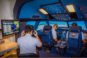 three pilots using AAG's flight simulator